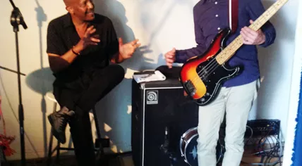 Perry Michael Allen (left) working with a young bass player