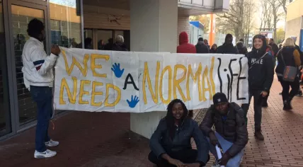 Some 30 failed asylum seekers under We Are Here occupy an empty office building on Reigersbos in Amsterdam Zuidoost, 27 Nov 2016