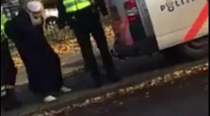 An 84-year-old man handcuffed by Amsterdam police after a traffic violation, 22 Nov 2016