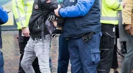 A 12-year-old boy being arrested in Amsterdam Zuidoost, 24 Jan 2017