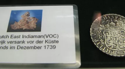 A silver coin from De Rooswijk, a Dutch East Indies ship that sank near England in 1740
