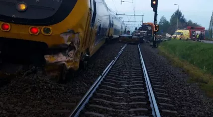 Train derails after crashing into a truck in Wouw, Noord-Brabant, 28 Apr 2017