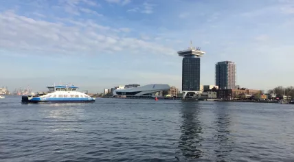 Ferry boat approaching Amsterdam Central Station, 30 March 2017