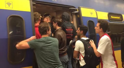 Passengers cram into a train in Amsterdam after the Europa League finals match between Ajax and Manchester, 24/25 May 2017