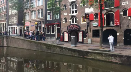 Tourists gather in Amsterdam's Red Light District, 8 Jun 2017