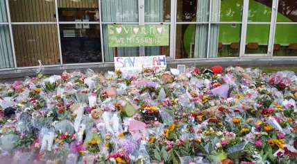 A sea of flowers left outside murdered Savannah Dekker's school after a silent march in honor of the 14-year-old girl, 8 Jun 2017