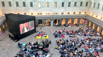 Amsterdammers gather at the Scheepvaartmuseum to watch mayor Eberhard van der Laan's interview on Zomergasten, 30 Jul 2017