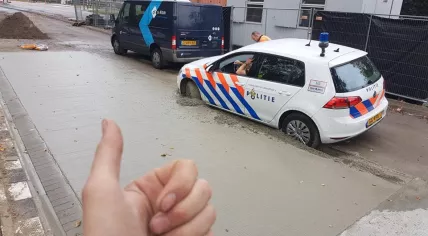 Police car stuck in newly poured concrete at a construction site in Eindhoven, 26 Oct 2017
