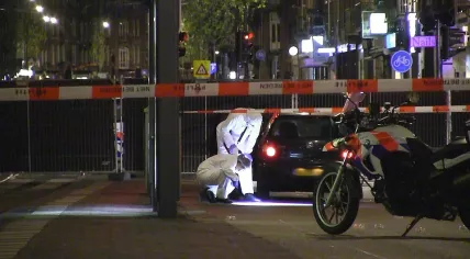 Forensic investigators at the scene of a fatal shooting on De Clercqstraat, 13 May 2015