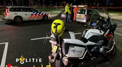 Bystanders escort an elderly woman in a microcar off the A1 highway near Amsterdam, 25 Dec 2017