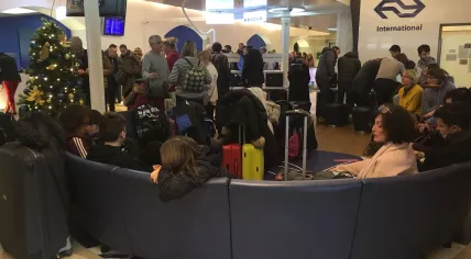 Train passengers waiting in Amsterdam NS lounge