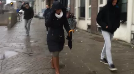 Pedestrians fight the wind in Amsterdam, 3 Jan 2018