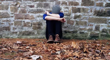 Stock photo teen on stone wall