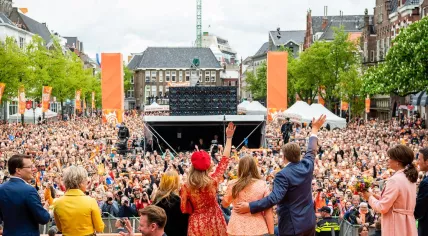 The Dutch Royals wave at the thousands gathered on Vismarkt after spending King's Day in Groningen, 27 April 2018