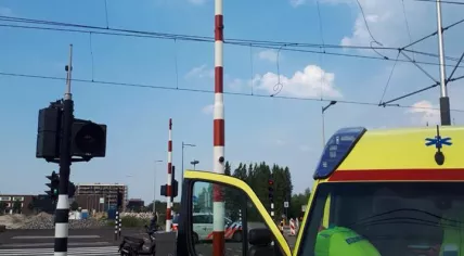 Ambulance and booms at a tram crossing on IJburglaan in Amsterdam, 23 May 2018