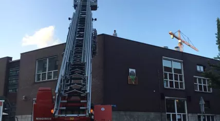 Fire department rescues a  9-year-old boy from the roof of a building on Baron G.A. Tindaplein in Amsterdam, 19 June 2018