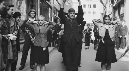 "Kraut girls" and members of the NSB being brought in by members of the Dutch resistance, 11 April 1945