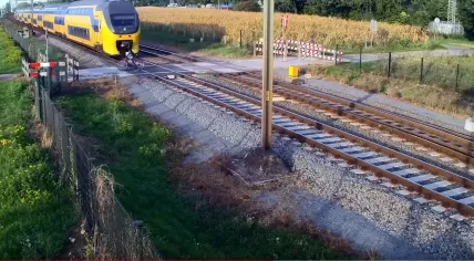 Cyclist narrowly escapes being hit by an NS Intercity train