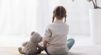 Child with teddy bear