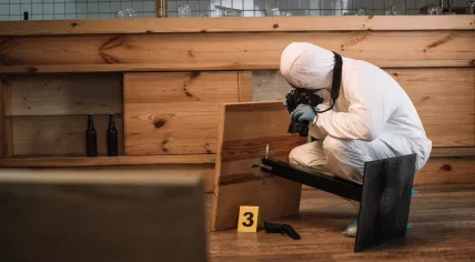 A forensic investigator at the scene of a crime