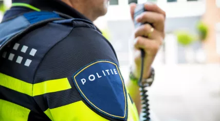 Dutch police officer talking on his radio