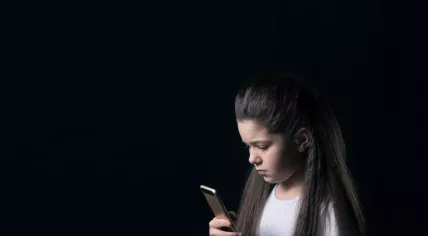 Young girl using mobile phone