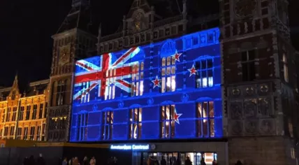 New Zealand flag projected onto Amsterdam Central Station after two attacks on Mosques in Christchurch, 15 March 2019