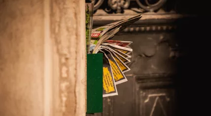 A postbox filled with junkmail