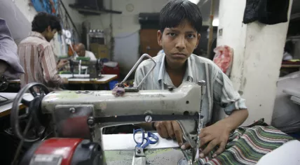 Boy working in a textile factory