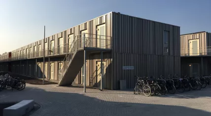 A mixed housing block for students and refugees at the University of Amsterdam Science Park