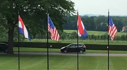 Dutch and American flags at the American WWII cemetery in Margraten