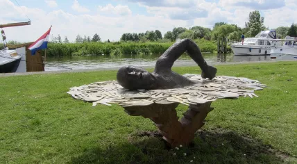 A statue of Maarten van der Weijden in Burdaard, where he had to give up his first attempt of his 11 cities swim tour in 2018