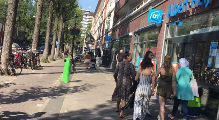 A group of women walk into an Albert Heijn location in Amsterdam Oost, 25 June 2019