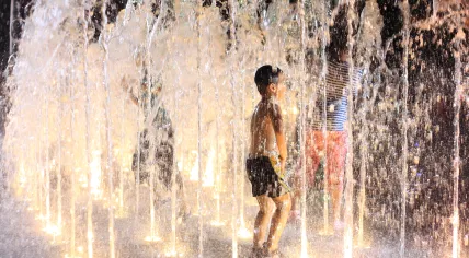 Kids playing in a fountain