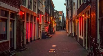 Red lights shining out of window brothels in Amsterdam's Red Light District