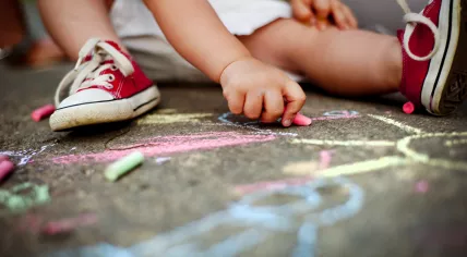 Child playing with chalk