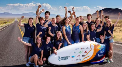 TU Delft and VU Amsterdam's Human Power Team with their aerodynamic recumbent bike