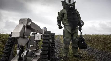 A Ministry of Defense explosive removal expert with explosive robot Telemax