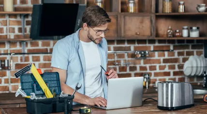 Man googling how to fix a toaster