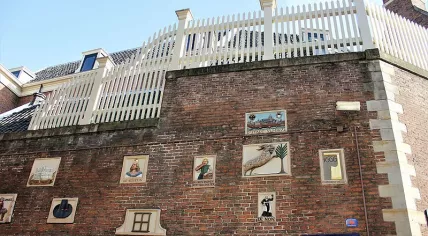 Tradesmans plaques on the wall of Amsterdam Museum
