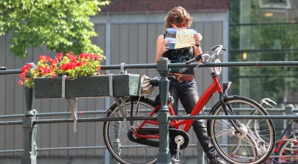 Tourist checking a map in Amsterdam