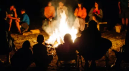 People gathered around a campfire 