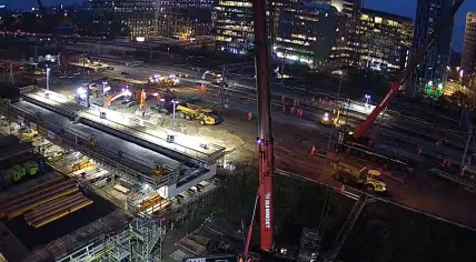 Construction crew working to install a massive rooftop for the new passenger tunnel from Amsterdam Zuid station across the A10 South and the railway, 1 Nov 2019