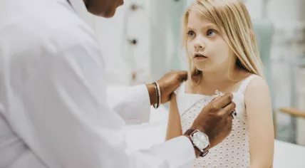 Pediatrician with a child patient