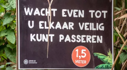 A sign in an Overloon shop telling people to maintain a safe social distance due to the coronavirus pandemic. 4 October 2020