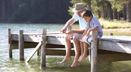 Man fishing with his grandson