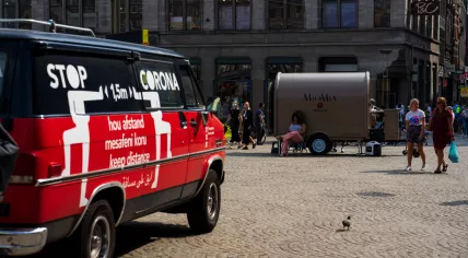 A coronavirus rules message on the side of an Amsterdam city vehicle on Leidseplein. Aug. 15, 2020