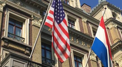 The flags of the United States and the Netherlands fly over the entrance to the Amstel Hotel in Amsterdam. 12 August 2020