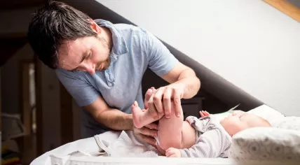 Father changing a diaper