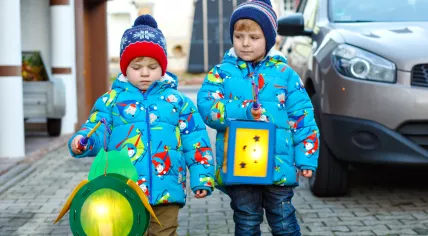 Kids holding handmade lanterns for Sint Maarten